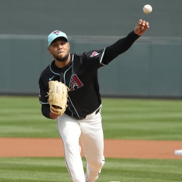 Feb 27, 2024; Salt River Pima-Maricopa, Arizona, USA; Arizona Diamondbacks starting pitcher Eduardo Rodriguez (57) throws against the Texas Rangers during the first inning at Salt River Fields at Talking Stick. Mandatory Credit: Rick Scuteri-USA TODAY Sports