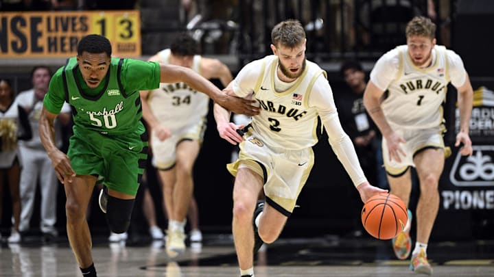 Nov 23, 2024; West Lafayette, Indiana, USA;  Marshall Thundering Herd guard Jalen Speer (50) defends Purdue Boilermakers guard Braden Smith (3) back after he stole the ball during the second half at Mackey Arena. Mandatory Credit: Marc Lebryk-Imagn Images