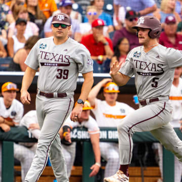Jun 22, 2024; Omaha, NE, USA; Texas A&M Aggies designated hitter Hayden Schott (5) scores a run against the Tennessee Volunteers during the third inning at Charles Schwab Field Omaha. Mandatory Credit: Dylan Widger-USA TODAY Sports