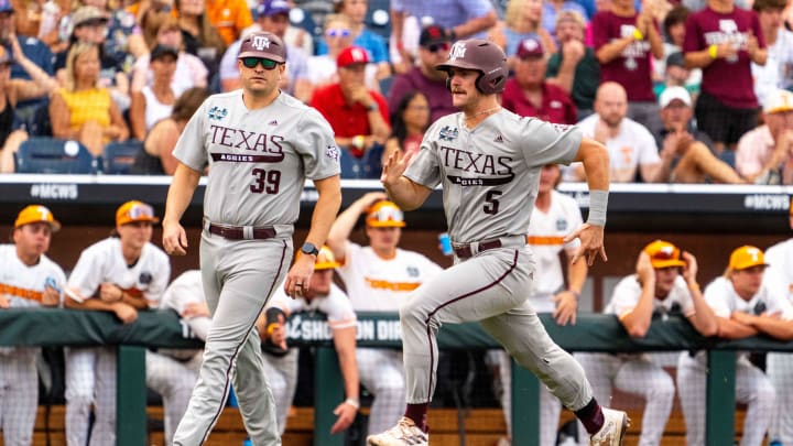 Jun 22, 2024; Omaha, NE, USA; Texas A&M Aggies designated hitter Hayden Schott (5) scores a run against the Tennessee Volunteers during the third inning at Charles Schwab Field Omaha. Mandatory Credit: Dylan Widger-USA TODAY Sports