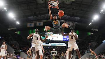 Baylor Bears center Caden Powell (44) dunks the ball against the Washington Huskies during the second half at Paul and Alejandra Foster Pavilion
