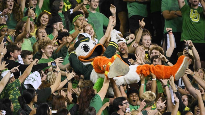 Oct 1, 2022; Eugene, Oregon, USA; The Oregon Ducks mascot is lifted by fans during a time out in the second half against the Stanford Cardinal at Autzen Stadium. The Ducks won the game 45-27. Mandatory Credit: Troy Wayrynen-USA TODAY Sports