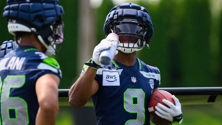 Jul 27, 2024; Renton, WA, USA; Seattle Seahawks running back Kenneth Walker III (9) takes a water break during training camp at Virginia Mason Athletic Center. Mandatory Credit: Steven Bisig-USA TODAY Sports