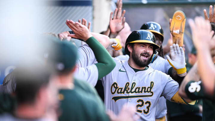 Jul 27, 2024; Anaheim, California, USA; Oakland Athletics catcher Shea Langeliers (23) celebrates teammates after hitting a three-run home run against the Los Angeles Angels during the first inning at Angel Stadium. Mandatory Credit: Jonathan Hui-USA TODAY Sports