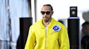 Oct 20, 2024; Austin, Texas, USA; Mercedes AMG Petronas F1 Team driver Lewis Hamilton (44) of Team Great Britain walks through the track entrance before the 2024 Formula One US Grand Prix at Circuit of the Americas. Mandatory Credit: Jerome Miron-Imagn Images