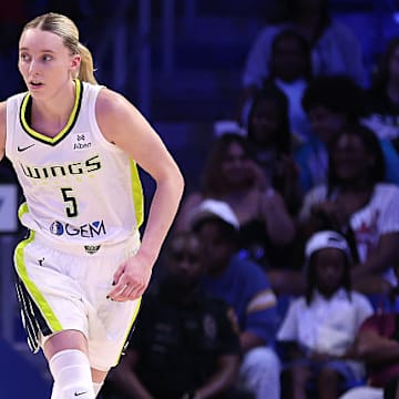 Paige Bueckers had 15 points, five rebounds and six assists in her first preseason game in Dallas. 