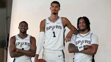 Sep 29, 2025; San Antonio, TX, USA; San Antonio Spurs forward-center Victor Wembanyama (1) and guards De’Aaron Fox (4) and Stephon Castle (5) pose for photos during Media Day at Victory Capital Performance Center in San Antonio. Mandatory Credit: Scott Wachter-Imagn Images
