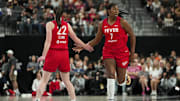 Jun 22, 2025; Las Vegas, Nevada, USA; Indiana Fever center Aliyah Boston (7) celebrates with guard Caitlin Clark (22) after scoring against the Las Vegas Aces during the first half of a WNBA basketball game at T-Mobile Arena. Mandatory Credit: Lucas Peltier-Imagn Images