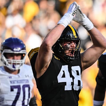 Oct 26, 2024; Iowa City, Iowa, USA; Iowa Hawkeyes defensive lineman Max Llewellyn (48) reacts after a safety against the Northwestern Wildcats during the second quarter at Kinnick Stadium. Mandatory Credit: Jeffrey Becker-Imagn Images