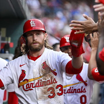 Jun 5, 2025; St. Louis, Missouri, USA;  St. Louis Cardinals second baseman Brendan Donovan (33) is congratulated by teammates after scoring against the Kansas City Royals during the third inning at Busch Stadium. Mandatory Credit: Jeff Curry-Imagn Images