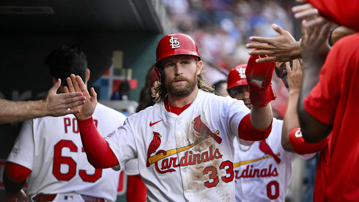 Jun 5, 2025; St. Louis, Missouri, USA;  St. Louis Cardinals second baseman Brendan Donovan (33) is congratulated by teammates after scoring against the Kansas City Royals during the third inning at Busch Stadium. Mandatory Credit: Jeff Curry-Imagn Images