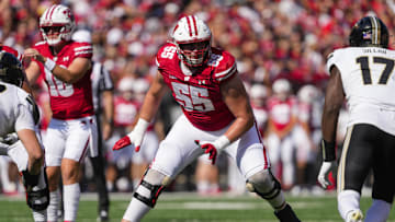 Oct 5, 2024; Madison, Wisconsin, USA;  Wisconsin Badgers offensive linenam Kevin Heywood (55) during the game against the Purdue Boilermakers at Camp Randall Stadium. Mandatory Credit: Jeff Hanisch-Imagn Images