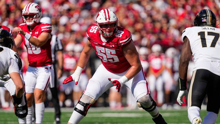 Oct 5, 2024; Madison, Wisconsin, USA;  Wisconsin Badgers offensive linenam Kevin Heywood (55) during the game against the Purdue Boilermakers at Camp Randall Stadium. Mandatory Credit: Jeff Hanisch-Imagn Images