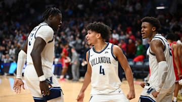 Feb 12, 2025; Villanova, Pennsylvania, USA; Villanova Wildcats guard Tyler Perkins (4) celebrates with forward Enoch Boakye (13) and guard Jordan Longino (15) after the game against St. John's basketball at William B. Finneran Pavilion. 