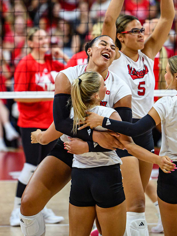 Teraya Sigler hugs Keri Leimbach after a point. 