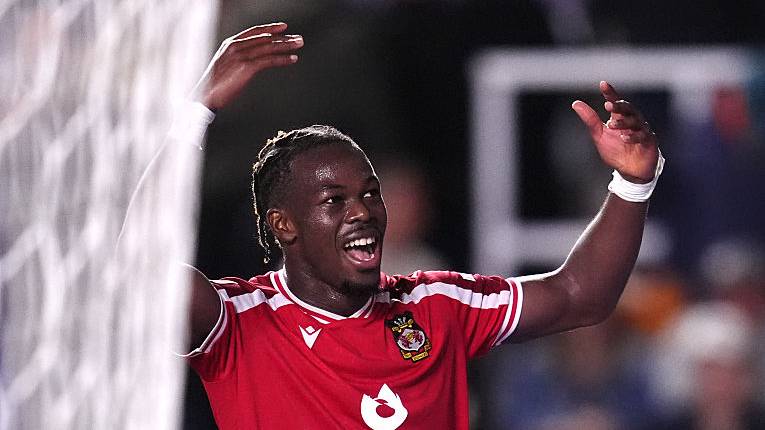 Jacques Ekomie celebrates scoring their side's third goal of the game during the Sky Bet Championship.