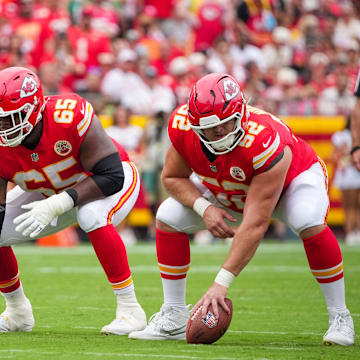 Sep 14, 2025; Kansas City, Missouri, USA; Kansas City Chiefs offensive tackle Jawaan Taylor (74) and guard Trey Smith (65) and center Creed Humphrey (52) at the line of scrimmage against the Philadelphia Eagles during the game at GEHA Field at Arrowhead Stadium. Mandatory Credit: Denny Medley-Imagn Images