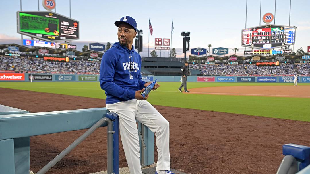 Apr 10, 2026; Los Angeles, California, USA; Los Angeles Dodgers shortstop Mookie Betts (50) looks on from the dugout steps during the game against the Texas Rangers at Dodger Stadium. Mandatory Credit: Jayne Kamin-Oncea-Imagn Images