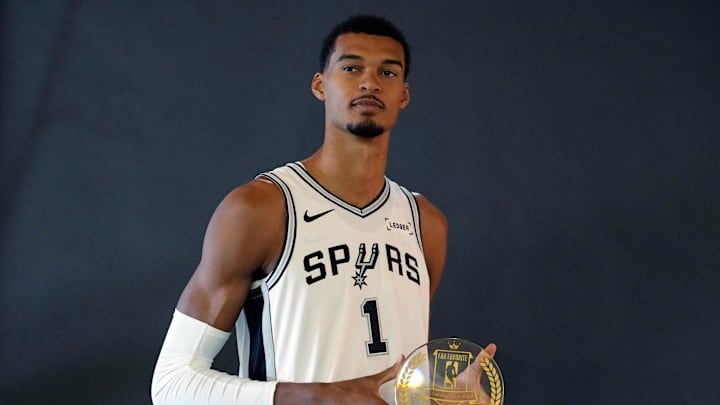 Sep 29, 2025; San Antonio, TX, USA; San Antonio Spurs forward-center Victor Wembanyama (1) holds his Fan Favorite award for Defensive Player of the Year during Media Day at Victory Capital Performance Center in San Antonio. Mandatory Credit: Scott Wachter-Imagn Images Sep 29, 2025; San Antonio, TX, USA; San Antonio Spurs forward-center Victor Wembanyama (1) holds his Fan Favorite award for Defensive Player of the Year during Media Day at Victory Capital Performance Center in San Antonio. Mandatory Credit: Scott Wachter-Imagn Images