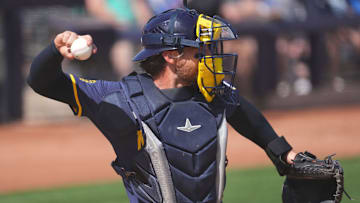 Mar 14, 2024; Peoria, Arizona, USA; Milwaukee Brewers catcher Eric Haase (13) throws to second base against the Seattle Mariners during the second inning at Peoria Sports Complex. Mandatory Credit: Joe Camporeale-USA TODAY Sports