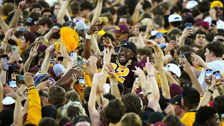 Arizona State fans celebrate with Sun Devils running back Jason Brown Jr. after beating BYU.