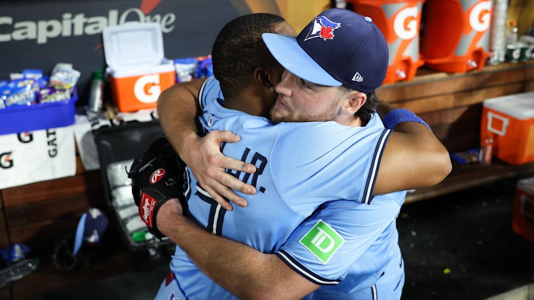 Toronto Blue Jays pitcher Trey Yesavage (39) hugs Toronto Blue Jays first baseman Vladimir Guerrero Jr. (27) after the game against the Los Angeles Dodgers during game five of the 2025 MLB World Series at Dodger Stadium.