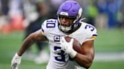Dec 22, 2024; Seattle, Washington, USA; Minnesota Vikings fullback C.J. Ham (30) carries the ball against the Seattle Seahawks during the first half at Lumen Field.