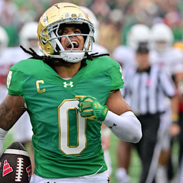 Sep 28, 2024; South Bend, Indiana, USA; Notre Dame Fighting Irish safety Xavier Watts (0) celebrates after an interception against the Louisville Cardinals in the second quarter at Notre Dame Stadium. Mandatory Credit: Matt Cashore-Imagn Images