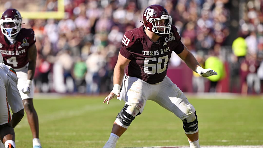 Dec 20, 2025; College Station, TX, USA; Texas A&M Aggies offensive lineman Trey Zuhn III (60) blocks the rush during the game between the Aggies and the Hurricanes at Kyle Field. Mandatory Credit: Jerome Miron-Imagn Images