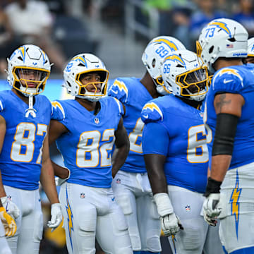 Aug 10, 2024; Inglewood, California, USA; Los Angeles Chargers wide receiver Brenden Rice (82), wide receiver Simi Fehoko (87), guard Willis Patrick (66) and other teammates against the Seattle Seahawks during the third quarter at SoFi Stadium. Mandatory Credit: Jonathan Hui-Imagn Images