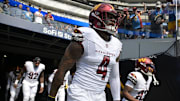 Oct 5, 2025; Inglewood, California, USA; Washington Commanders linebacker Frankie Luvu (4) runs on field before the game against the Los Angeles Chargers  at SoFi Stadium. Mandatory Credit: Jayne Kamin-Oncea-Imagn Images