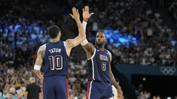 Aug 6, 2024; Paris, France; United States forward LeBron James (6) and forward Jayson Tatum (10) react in the first half against Brazil in a men’s basketball quarterfinal game during the Paris 2024 Olympic Summer Games at Accor Arena. 