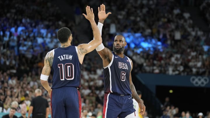 Aug 6, 2024; Paris, France; United States forward LeBron James (6) and forward Jayson Tatum (10) react in the first half against Brazil in a men’s basketball quarterfinal game during the Paris 2024 Olympic Summer Games at Accor Arena. Mandatory Credit: Kyle Terada-USA TODAY Sports