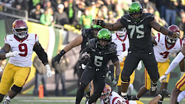 The World is More Than Enough: Noah Whittington runs through a huge hole for a touchdown against USC.