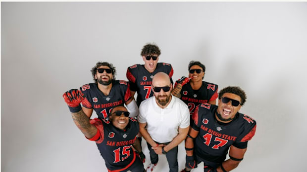 San Diego State Aztecs football players posing while wearing 'Be The A1pha' sunglasses from a collaboration with Blenders Eye