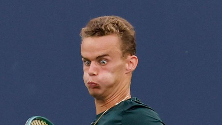 Luca Van Assche hits a forehand