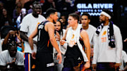Oct 31, 2025; Phoenix, Arizona, USA;  Phoenix Suns guard Devin Booker (1) and the Suns bench react to a three-point shot by Booker in the second half between the Phoenix Suns and the Utah Jazz at Mortgage Matchup Center. Mandatory Credit: Arianna Grainey-Imagn Images