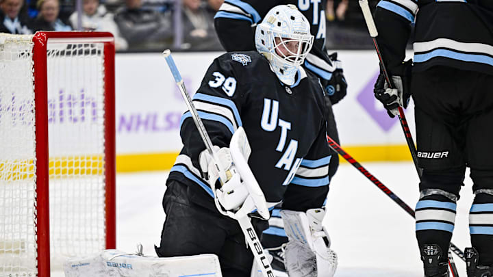Jan 18, 2025; Salt Lake City, Utah, USA; Utah Hockey Club goalie Connor Ingram (39) returns a blocked shot to the ice against the St. Louis Blues during third period at the Delta Center. Mandatory Credit: Christopher Creveling-Imagn Images