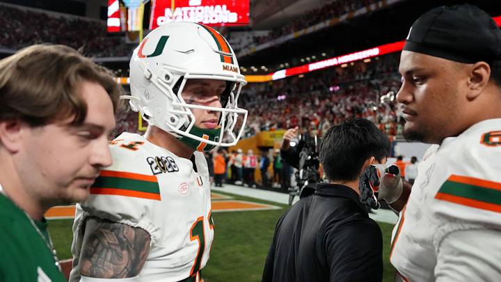 Jan 19, 2026; Miami Gardens, FL, USA; Miami Hurricanes quarterback Carson Beck (11) and offensive lineman Francis Mauigoa (61) react after losing to Indiana Hoosiers inthe College Football Playoff National Championship game at Hard Rock Stadium. Mandatory Credit: Kirby Lee-Imagn Images
