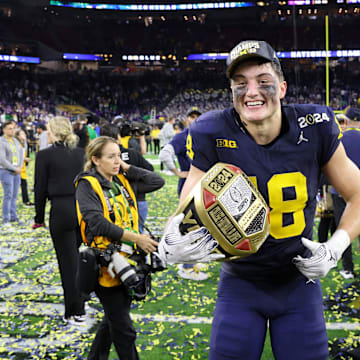 Jan 8, 2024; Houston, TX, USA; Michigan Wolverines tight end Colston Loveland (18) celebrates after winning 2024 College Football Playoff national championship game against the Washington Huskies at NRG Stadium. Mandatory Credit: Thomas Shea-Imagn Images