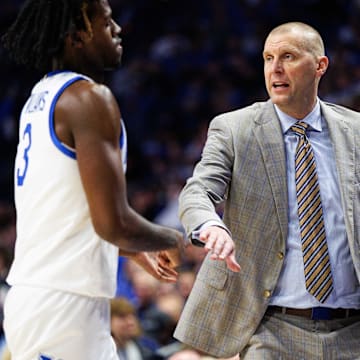 Nov 7, 2025; Lexington, Kentucky, USA; Kentucky Wildcats head coach Mark Pope fives guard Kam Williams (3) as he returns to the bench during the first half against the Valparaiso Beacons at Rupp Arena at Central Bank Center. Mandatory Credit: Jordan Prather-Imagn Images