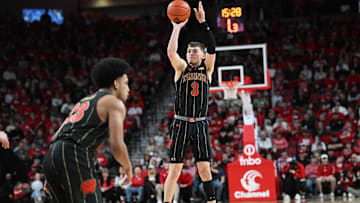 Feb 11, 2023; Lincoln, Nebraska, USA;  Wisconsin Badgers guard Connor Essegian (3) attempts a three point shot against the Nebraska Cornhuskers in the second half at Pinnacle Bank Arena. Mandatory Credit: Steven Branscombe-Imagn Images