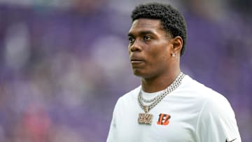Injured Cincinnati Bengals cornerback Cam Taylor-Britt (29) walks the field during warmups before the first quarter of the NFL Week 3 game between the Minnesota Vikings and the Cincinnati Bengals at U.S. Bank Stadium in Minneapolis on Sunday, Sept. 21, 2025.