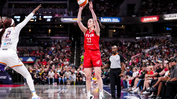 Indiana Fever guard Caitlin Clark (22) shoots a 3-pointer Friday, Aug. 16, 2024, during the game at Gainbridge Fieldhouse in Indianapolis.