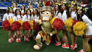 Jan 2, 2023; Arlington, Texas, USA; A view of the USC Trojans song girl cheerleaders and mascot during the first half of the game between the USC Trojans and the Tulane Green Wave in the 2023 Cotton Bowl at AT&T Stadium. Mandatory Credit: Jerome Miron-USA TODAY Sports
