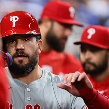 Sep 6, 2024; Miami, Florida, USA; Philadelphia Phillies designated hitter Kyle Schwarber (12) celebrates after scoring against the Miami Marlins during the first inning at loanDepot Park.