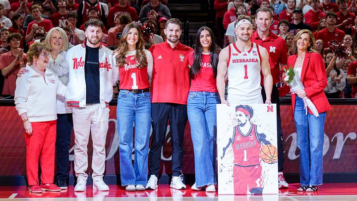 Mar 8, 2026; Lincoln, Nebraska, USA; Nebraska Cornhuskers guard Sam Hoiberg (1) poses with family during the senior day ceremony before the game against the Iowa Hawkeyes at Pinnacle Bank Arena. Mandatory Credit: Dylan Widger-Imagn Images
