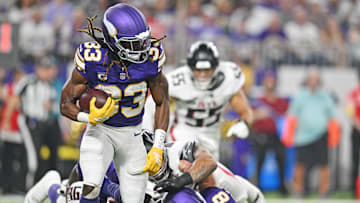 Sep 14, 2025; Minneapolis, Minnesota, USA; Minnesota Vikings running back Aaron Jones Sr. (33) runs the ball during the first half against the Atlanta Falcons at U.S. Bank Stadium.
