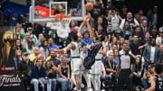 Jun 14, 2024; Dallas, Texas, USA; Dallas Mavericks guard Kyrie Irving (11) shoots over Boston Celtics forward Jayson Tatum (0) and guard Derrick White (9) during the first quarter of game four of the 2024 NBA Finals at American Airlines Center. Mandatory Credit: Jerome Miron-USA TODAY Sports