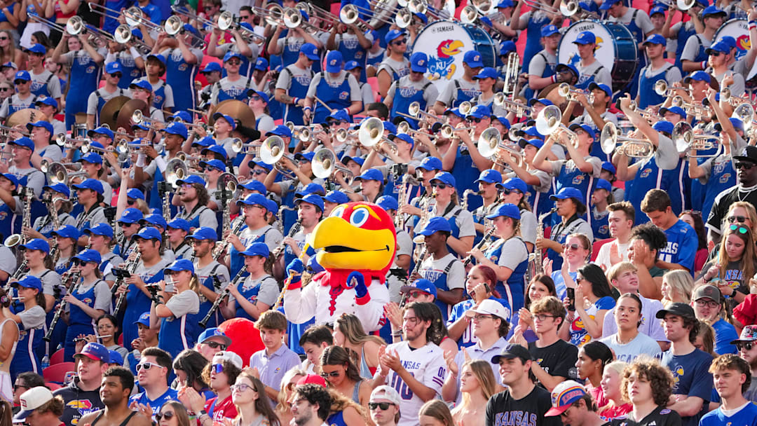 Sep 28, 2024; Kansas City, Missouri, USA; The Kansas Jayhawks mascot sits among the marching band during the second half of the game against the TCU Horned Frogs at GEHA Field at Arrowhead Stadium. Mandatory Credit: Denny Medley-Imagn Images